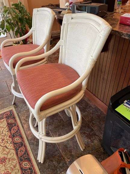 Sunroom. Two rattan cushioned rotating stools. Bar height.