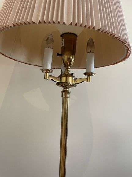Living room. Corner curio cabinet with standing lamp. Curio is 78 inches tall by approximately 27 inches wide.