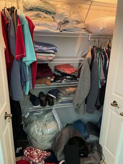 Bedroom. Contents of bedroom closet. Men’s clothing, extra large shirts, polos and button ups suit jackets, mostly size 48. Some linens, shoes, pillows, miscellaneous.