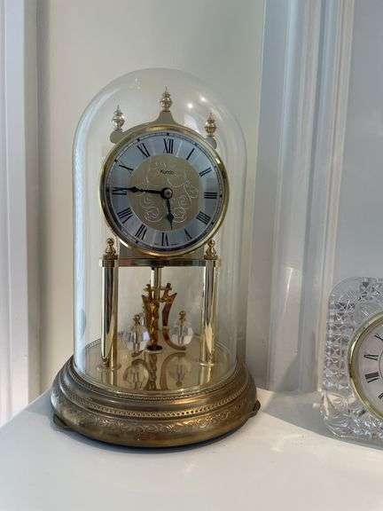 Living room. Lladro angel figurine. A mother’s touch figurine and two clocks.
