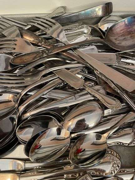 Lot of flatware. In dining room.