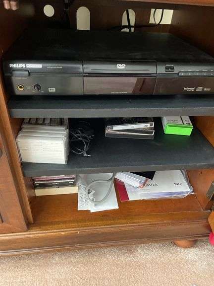 Living room. 40 inch Sony Bravia KDL – 40 XBR6 TV with remote powers on and is working includes Philips Magnavox DVD player.
