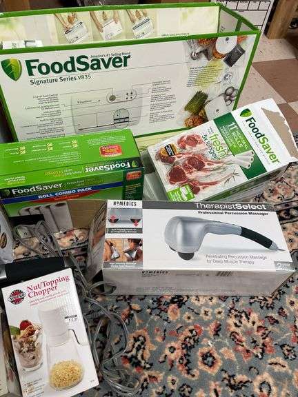 Nice lot includes Cuisinart meat grinder, food, saver, slicer, home medics massage unit. All for one money.