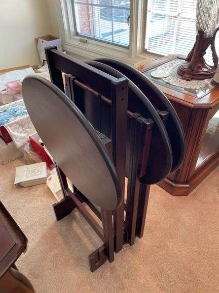 Living room. Two matching lamps with two side tables (one is a glass curio side table) and TV trays on stand. One TV tray is missing. Nice lot of furniture.