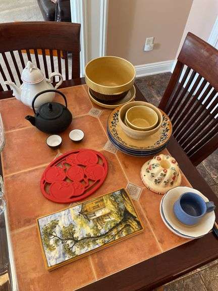 Kitchen. Over and back yellow Ware, bowls. Tea kettle with small tea, cups, and miscellaneous.