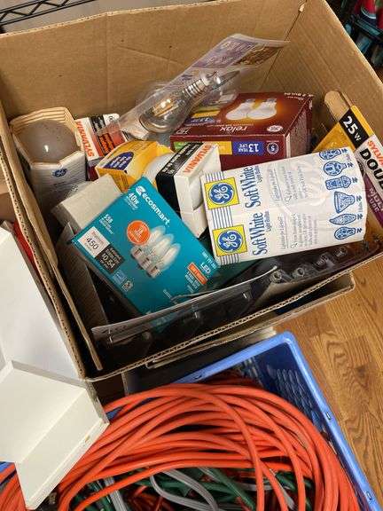 Lot includes plastic table, fire extinguisher, miscellaneous extension, cords, and lightbulbs