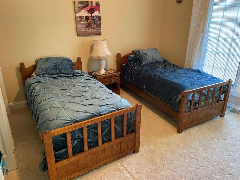 Quality twin bedroom set. Two single beds with frame and Sealy Posturepedic mattresses and bedding. Matching dresser, nightstand, bookshelf cabinet. Includes lamp on nightstand and miscellaneous items in drawers and shelves.