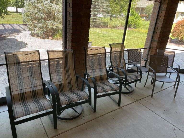 Outdoor set includes four chairs and round table also includes three miscellaneous outdoor side chairs