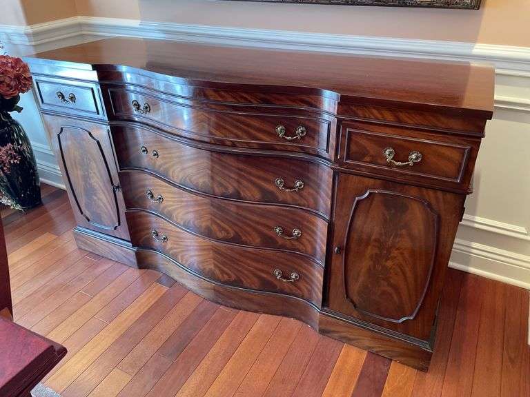 Dining room. Ornate Cherrywood finish 62 inches long 35 inches high 20 inches deep. Burl front veneers.  Not marked but assume same company as china cabinet.  One handle was missing.