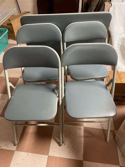 Four vinyl covered chairs and card table appear newer.