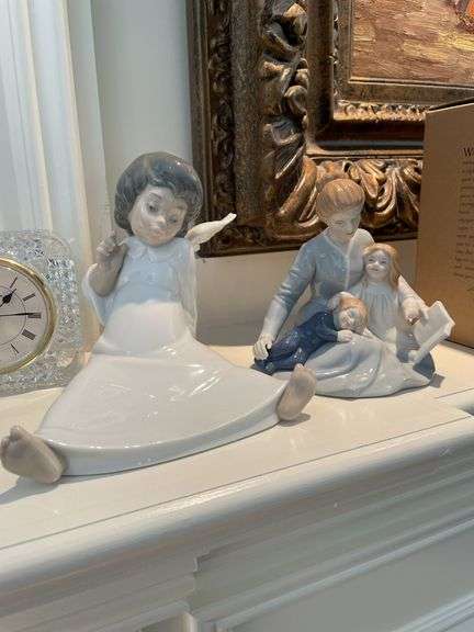 Living room. Lladro angel figurine. A mother’s touch figurine and two clocks.