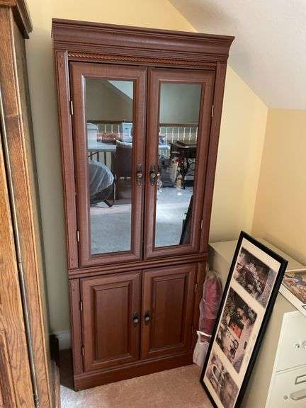 Glass fronted curio cabinet. Approximately 70 inches tall by 24 inches wide.