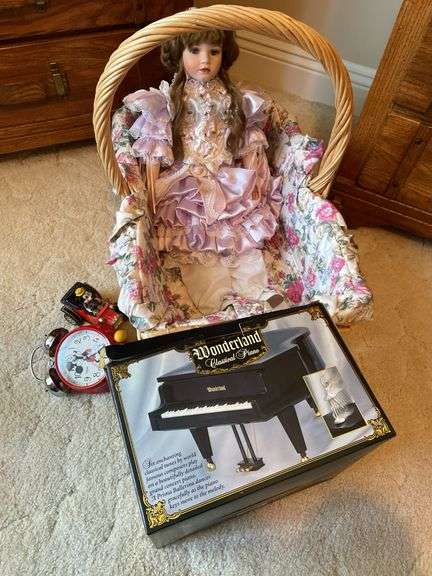 Bedroom. Wonderland classical piano in box. Mickey Mouse clock in toy with doll and basket.