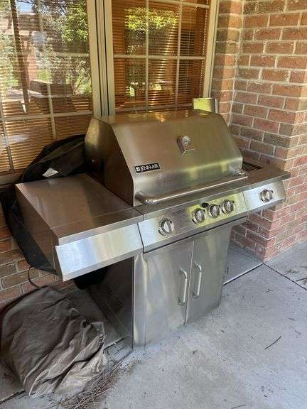 Jen air stainless gas grill and cover. Includes one tank.