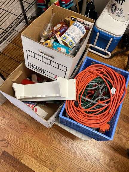 Lot includes plastic table, fire extinguisher, miscellaneous extension, cords, and lightbulbs