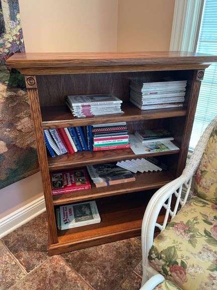 Sunroom. Bookshelf. 48 inches tall 36 inches wide. Well-made hardwood includes some cookbooks magazines.