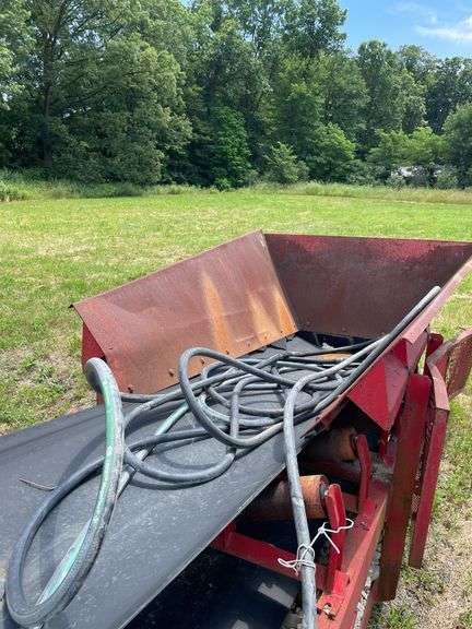 Red 80 foot aggregate conveyor. Non-engine hydraulic powered portable wheeled. -$1000 deposit.  balance in ACH or certified check within 48 hours of auction close