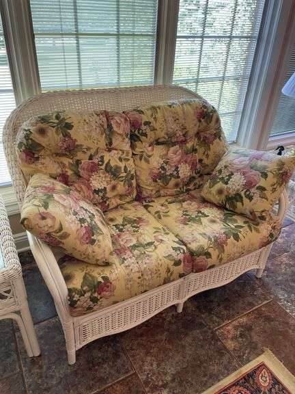 Sunroom. Lot of quality wicker furniture. Including loveseat. Two side chairs with Ottomans. Glass top wicker side tables. Includes floral cushions in good shape. With two matching lamps.