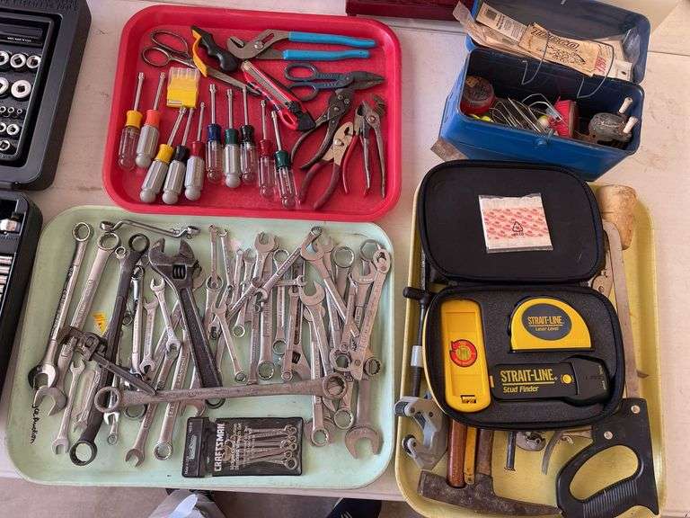 Three trays of tools, including wrenches, hand, tools, nut, drivers laser, level, and fishing gear.