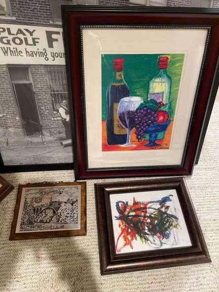 Basement. Large lot of framed wall art includes some prints photographs unique scenes. Nice variety review pictures for all pieces.