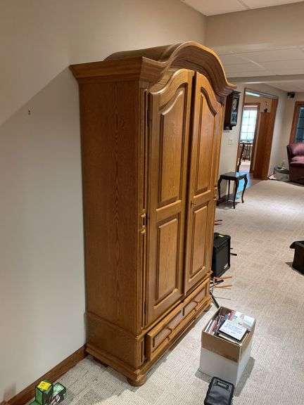 Basement. Maple wardrobe. Approximately 78 inches tall 40 inches wide 16 inches deep.