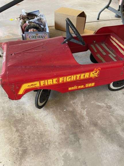 Vintage pedal car with all four wheels, pedals, and steering wheel intact