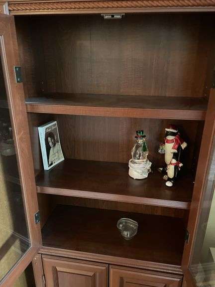 Glass fronted curio cabinet. Approximately 70 inches tall by 24 inches wide.