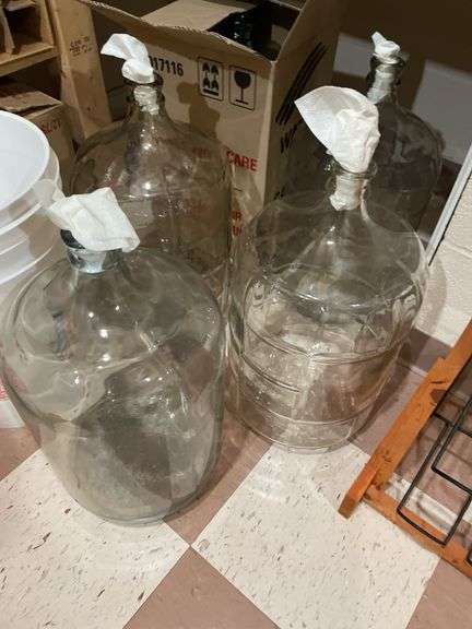 Basement. 4 each 5 gallon glass bottles, bucket