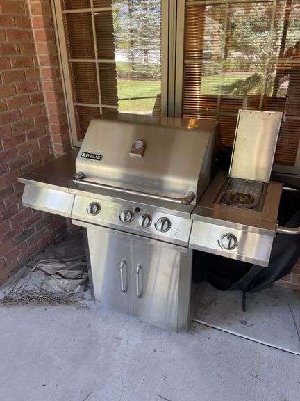 Jen air stainless gas grill and cover. Includes one tank.