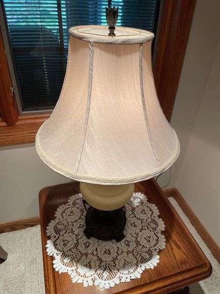 Basement. Side table with large ornate lamp. Side table is 28 inches wide.