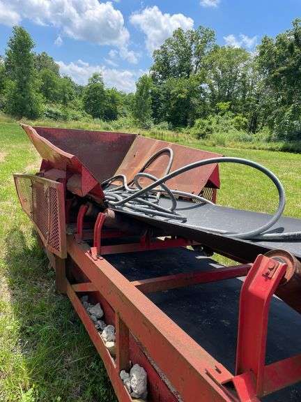 Red 80 foot aggregate conveyor. Non-engine hydraulic powered portable wheeled. -$1000 deposit.  balance in ACH or certified check within 48 hours of auction close