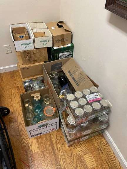 Lot of mason jars with lids.