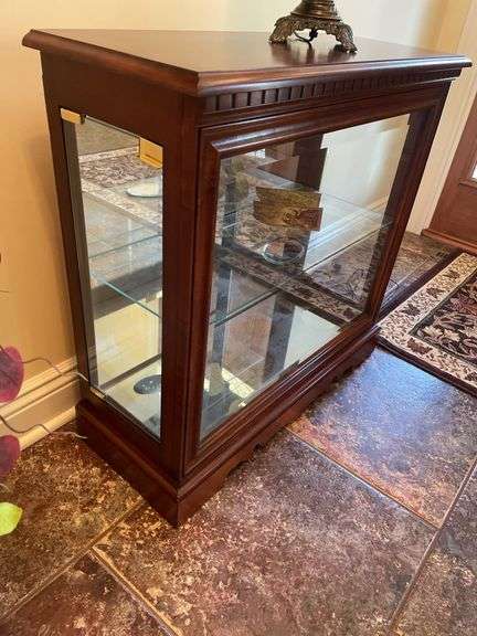 Entryway. Glass front curio. 30 x 28” with oil style electric lamp.