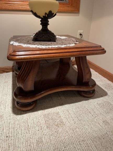 Basement. Side table with large ornate lamp. Side table is 28 inches wide.