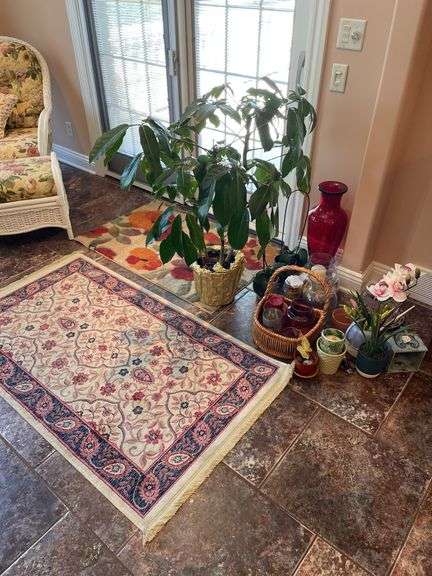 Sunroom. Two floral rugs. With decor and faux plant. Vases basket and faux plants.