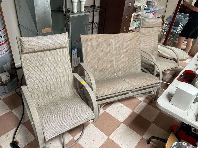 Nice outdoor set includes two rockers and glider and small resin table. Basement.