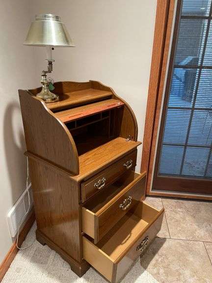 Newer tamber door secretary with brass desk lamp. Easy loadout.