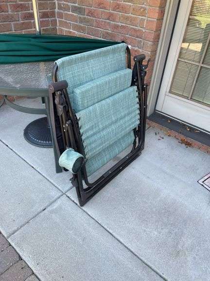 Outdoor set includes four chairs and round table also includes three miscellaneous outdoor side chairs