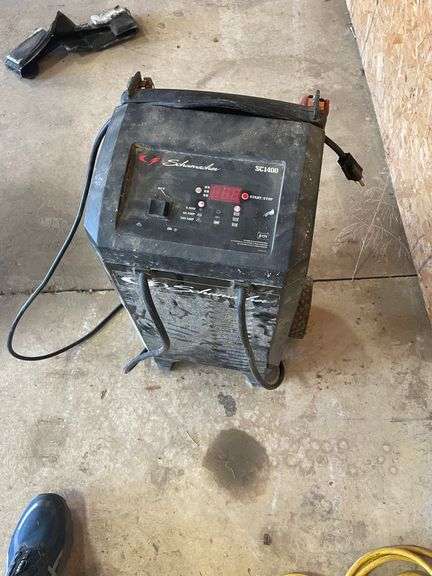Schumaker SC1400 Battery Charger & starter. Excellent well made unit we used this several times. Cannot be removed until end of scheduled pick up