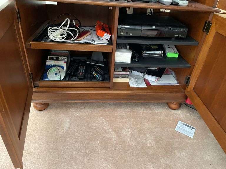 Living room. Entertainment cabinet. 78 inches tall 43 inches wide 25 inches deep.