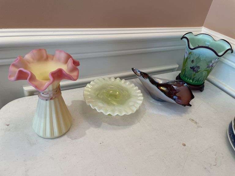 Dining room. Lot of unique colored glassware. Two pieces appear to be Fenton.