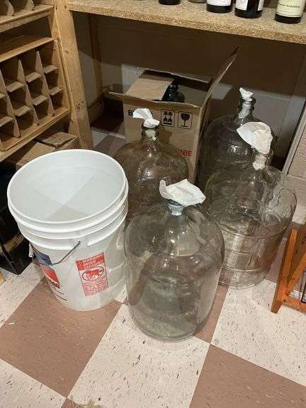 Basement. 4 each 5 gallon glass bottles, bucket