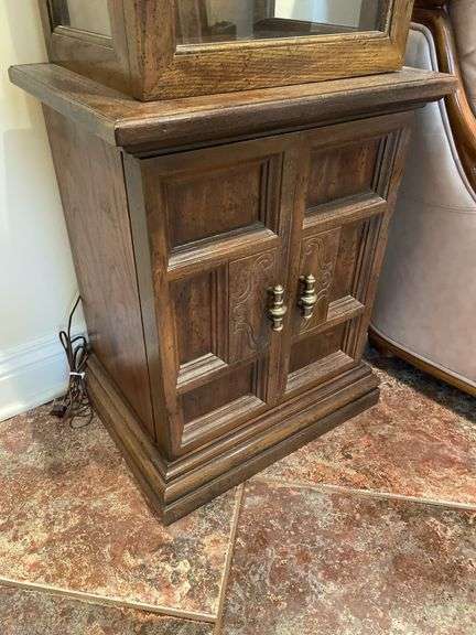 Entryway. Curio cabinet with light. 69 inches tall 19 inches wide.