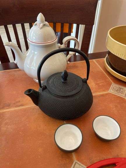 Kitchen. Over and back yellow Ware, bowls. Tea kettle with small tea, cups, and miscellaneous.