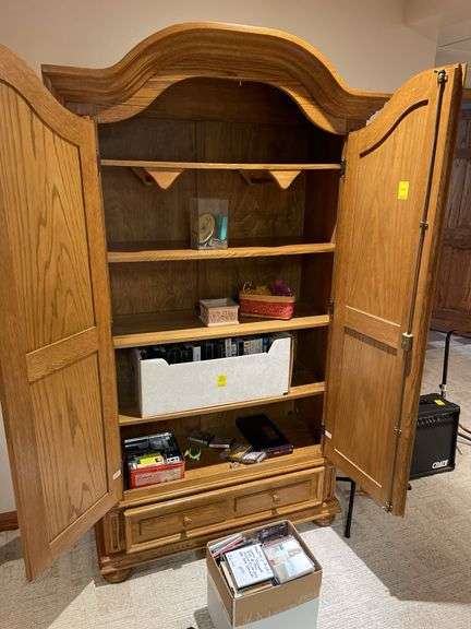 Basement. Maple wardrobe. Approximately 78 inches tall 40 inches wide 16 inches deep.