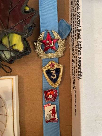 Dining room. Two trays of collectible miscellaneous. Soviet style pins. Unique mini chest. And more.