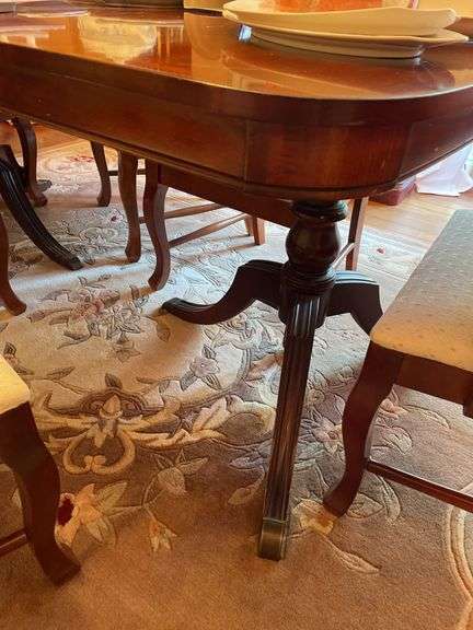 Dining room. Dining room table with leaf and cover. Includes six matching chairs. Only One captains chair.. Not including contents. Chairs may be different maker than table.