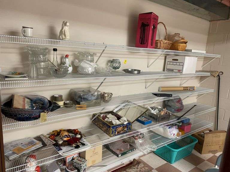 Contents of white shelves include some craft supplies, tins, miscellaneous.