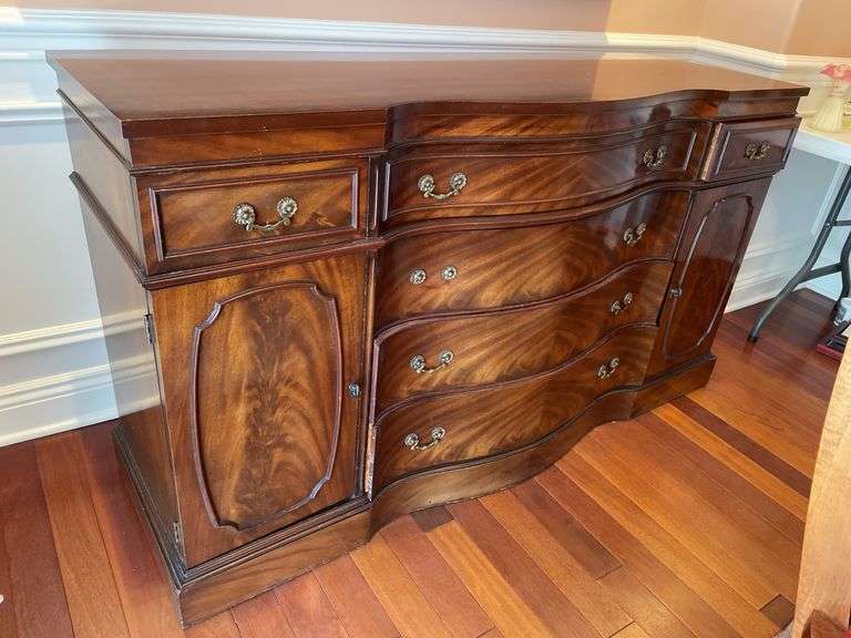 Dining room. Ornate Cherrywood finish 62 inches long 35 inches high 20 inches deep. Burl front veneers.  Not marked but assume same company as china cabinet.  One handle was missing.