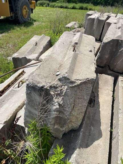 Approximately 84 stackable concrete Bin Blocks. Approximately 6’x2’x2’